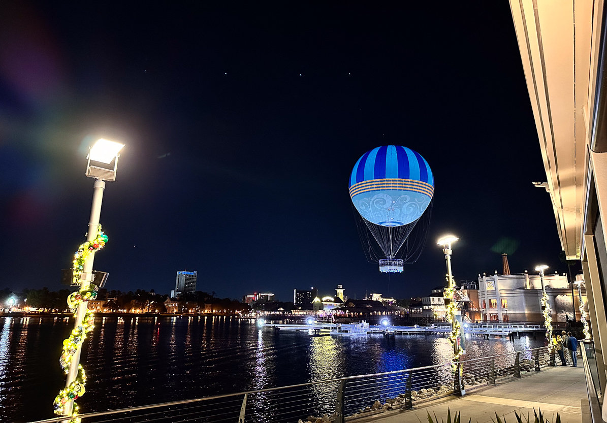 view of lake in disney springs with hot air balloon